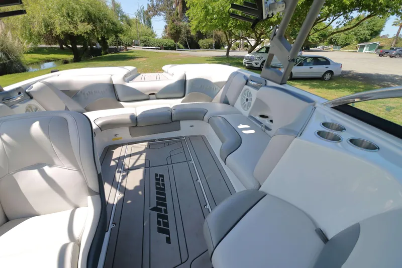 Slide: The Image of Interior of a 2018 Sanger 212 SL boat with gray and white seating. - 16