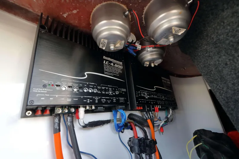 Slide: The Image of Engine compartment of a 2018 Sanger 212 SL boat featuring a Raptor 400 engine. - 19