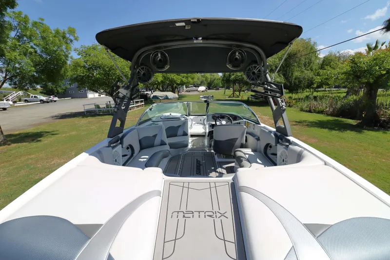 Slide: The Image of Interior of a 2018 Sanger 212 SL boat with seating and dashboard. - 8