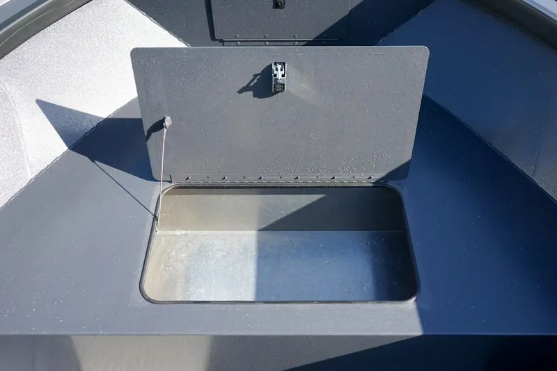 Slide: The Image of Open storage compartment in 2026 Alumaweld Adventurer 20 boat. - 16