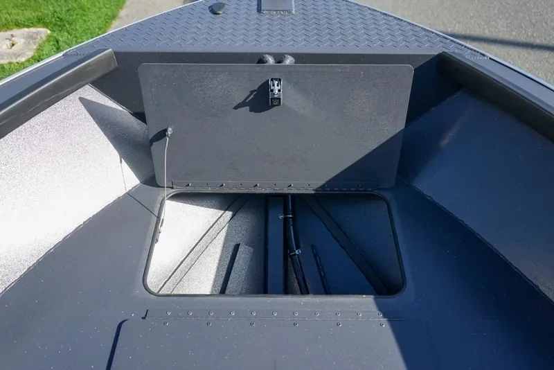 Slide: The Image of 2026 Alumaweld Adventurer 20 boat interior, featuring storage compartment and sleek design. - 17