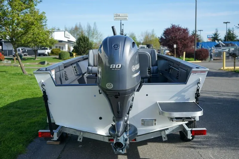 Slide: The Image of 2026 Alumaweld Adventurer 20 boat with Yamaha 80 jet drive engine, parked outdoors. - 5