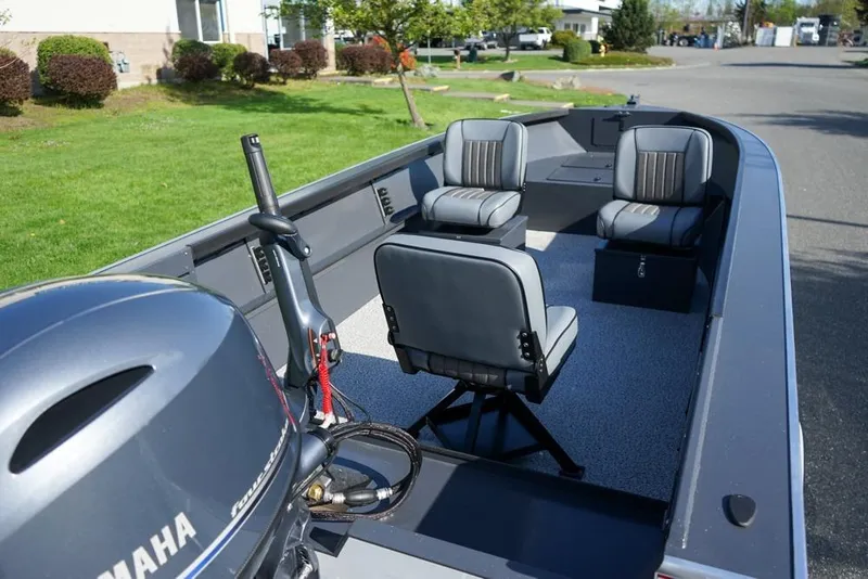 Slide: The Image of 2026 Alumaweld Adventurer 20 boat interior with Yamaha motor and seating arrangement. - 6