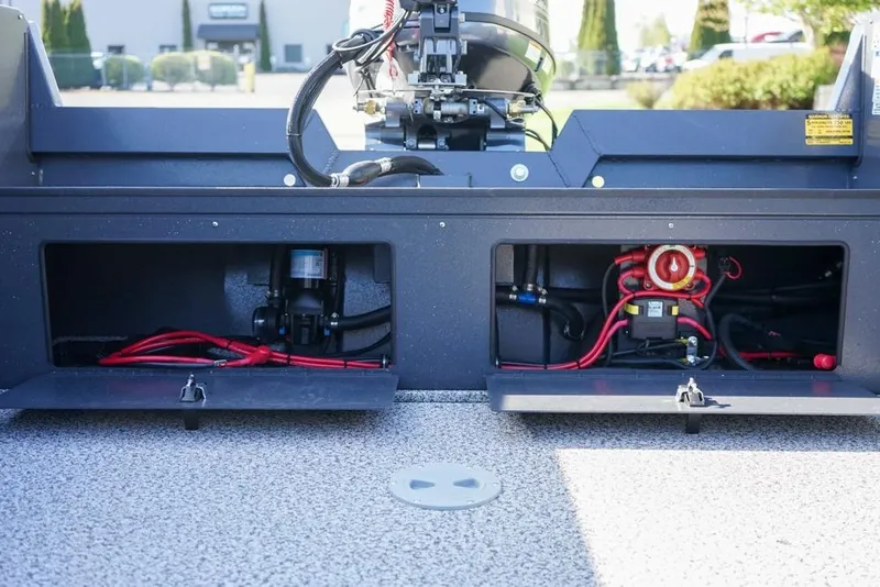 Slide: The Image of 2026 Alumaweld Adventurer 20 boat compartments with wiring and equipment visible. - 8