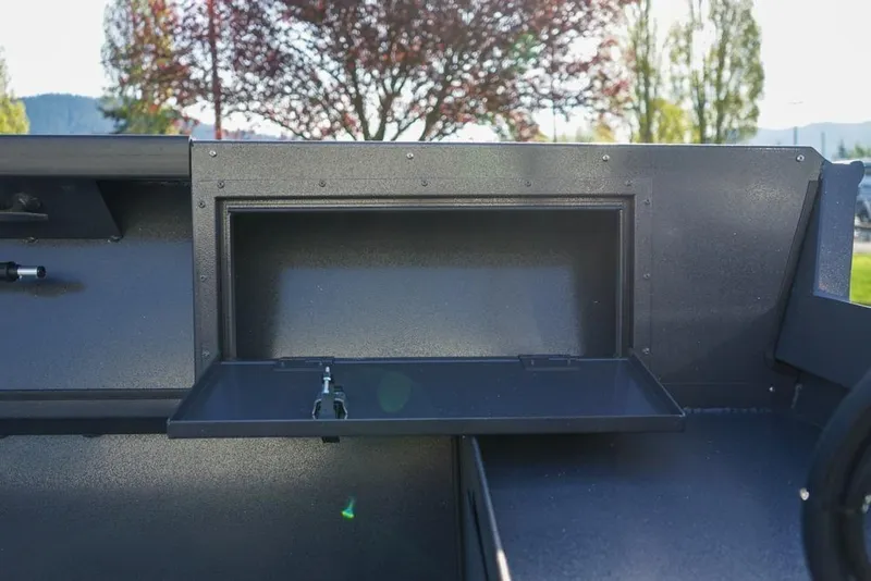 Slide: The Image of 2026 Alumaweld Adventurer 20 boat interior storage compartment with open hatch. - 9