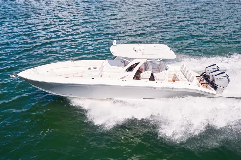 The Image of 2024 Midnight Express boat cruising on open water, showcasing sleek design and powerful engines. - 0