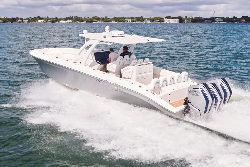 Slide: The Image of 2024 Midnight Express boat cruising on open water with powerful engines. - 3