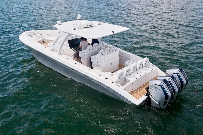 Slide: The Image of 2024 Midnight Express boat with triple engines cruising on open water. - 5