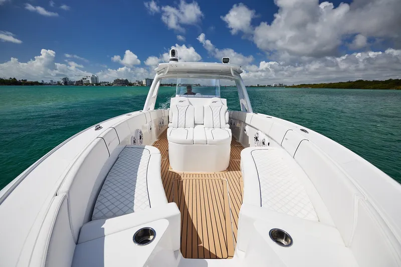 Slide: The Image of 2024 Midnight Express boat with luxurious white seating on open water. - 8