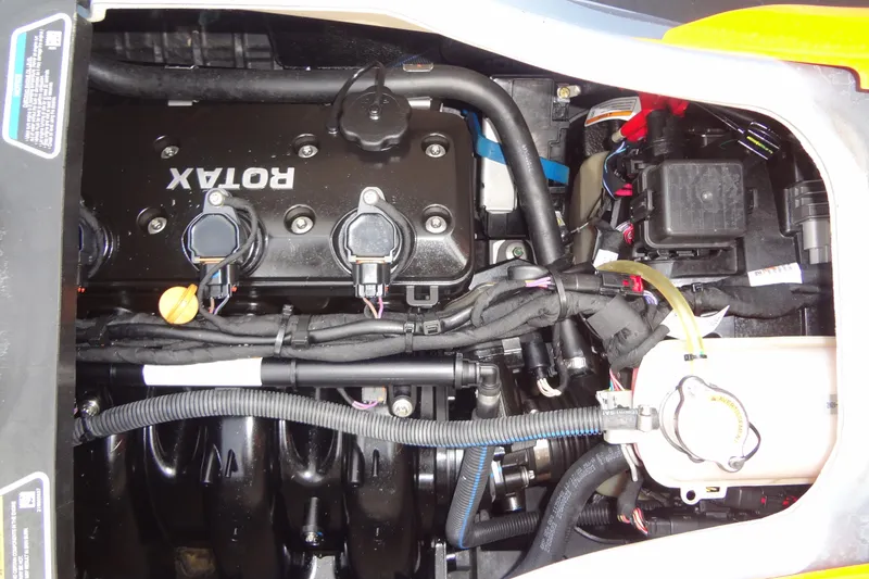 Slide: The Image of 2021 Seadoo GTI 170 SE engine compartment with Rotax engine components visible. - 13