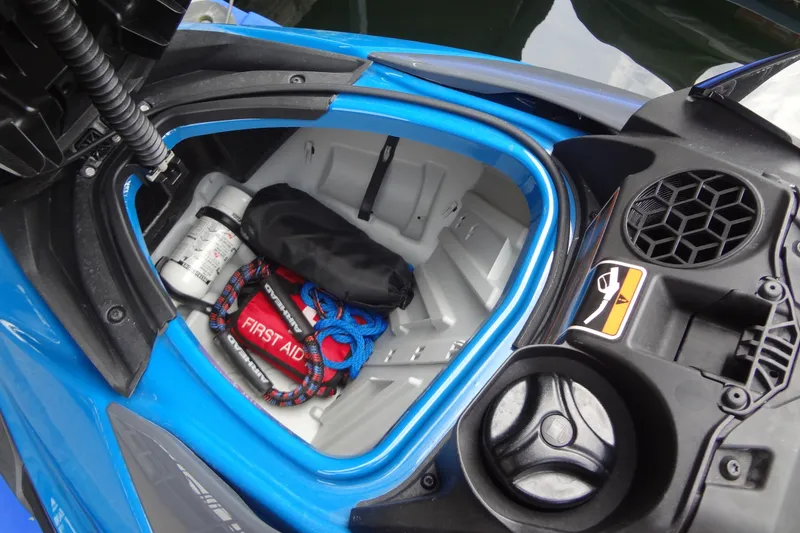 Slide: The Image of 2021 Seadoo GTI 170 SE storage compartment with safety gear and first aid kit. - 21