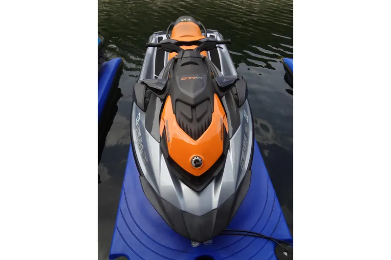 Slide: The Image of 2021 Seadoo GTI 170 SE jet ski in orange and black on water. - 6
