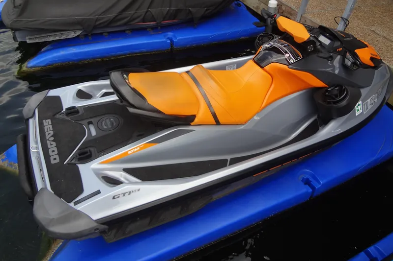 Slide: The Image of 2021 Seadoo GTI 170 SE jet ski with orange seat on blue dock. - 7