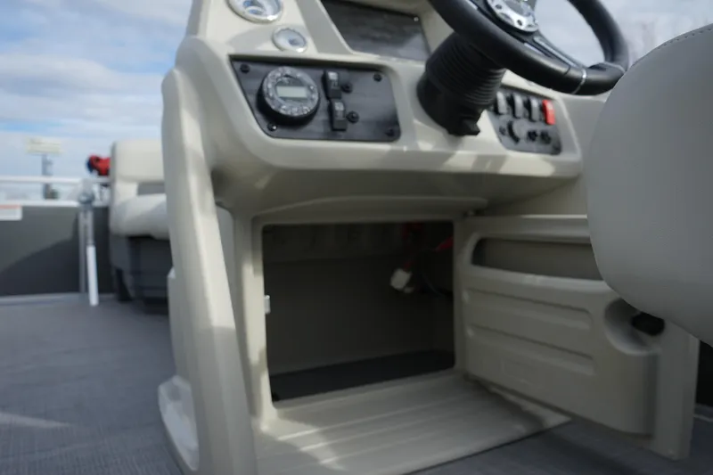Slide: The Image of 2025 Starcraft LX 16 R boat dashboard with steering wheel and control panel. - 10