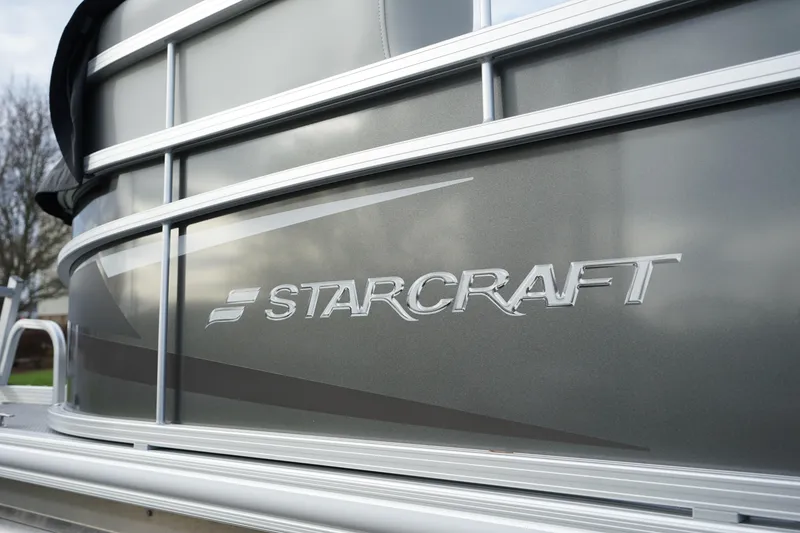 Slide: The Image of 2025 Starcraft LX 16 R boat exterior with logo detail. - 11
