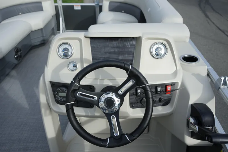 Slide: The Image of Steering console of 2025 Starcraft LX 16 R boat with gauges and controls. - 8