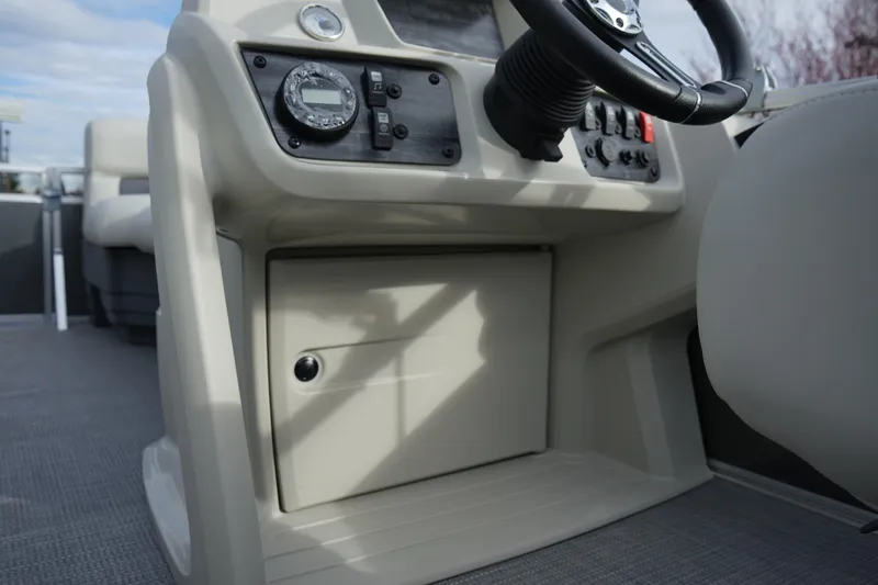 Slide: The Image of 2025 Starcraft LX 16 R boat dashboard with steering wheel and control panel. - 9