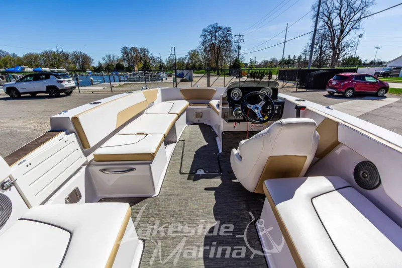 Slide: The Image of 2019 Glastron GTD 180 boat interior with spacious seating and modern dashboard at Lakeside Marina. - 12