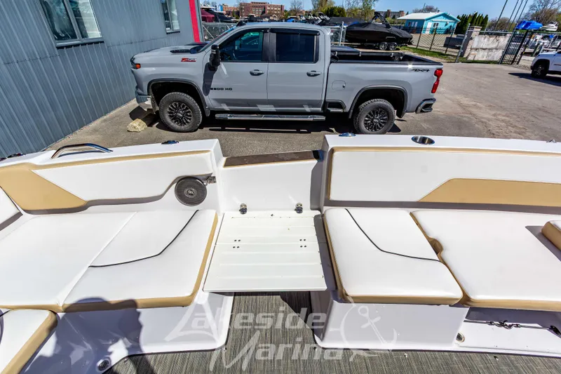 Slide: The Image of 2019 Glastron GTD 180 boat interior with a parked truck in the background. - 17