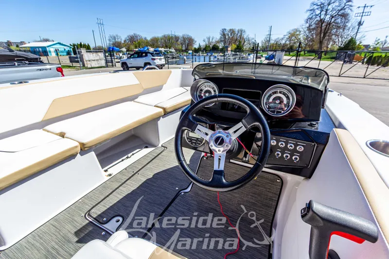 Slide: The Image of 2019 Glastron GTD 180 boat interior with steering wheel and dashboard at Lakeside Marina. - 19