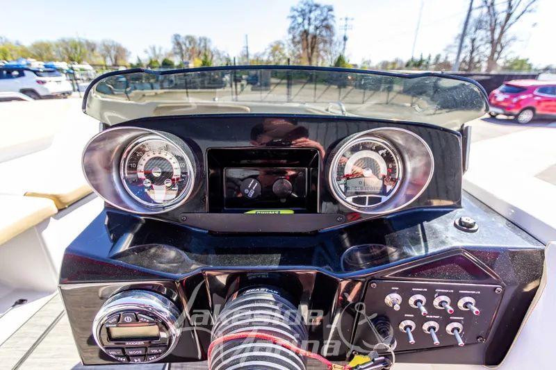 Slide: The Image of Dashboard of a 2019 Glastron GTD 180 boat with gauges and controls. - 22