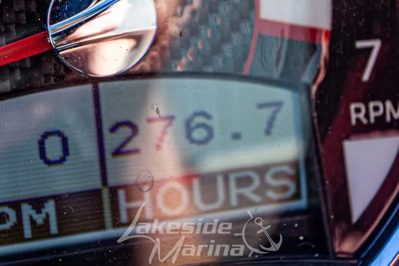 Slide: The Image of Close-up of a 2019 Glastron GTD 180 boat dashboard showing 276.7 hours. - 23