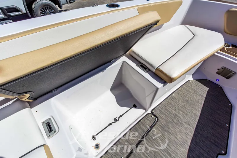 Slide: The Image of 2019 Glastron GTD 180 boat interior with open storage compartment and cushioned seating. - 25