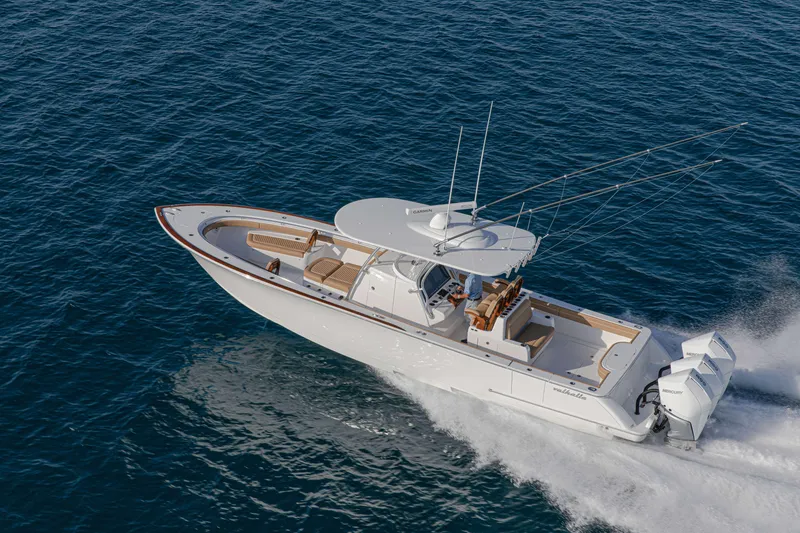 Slide: The Image of 2026 Valhalla Boatworks V-37 cruising on open water, showcasing sleek design and powerful engines. - 2