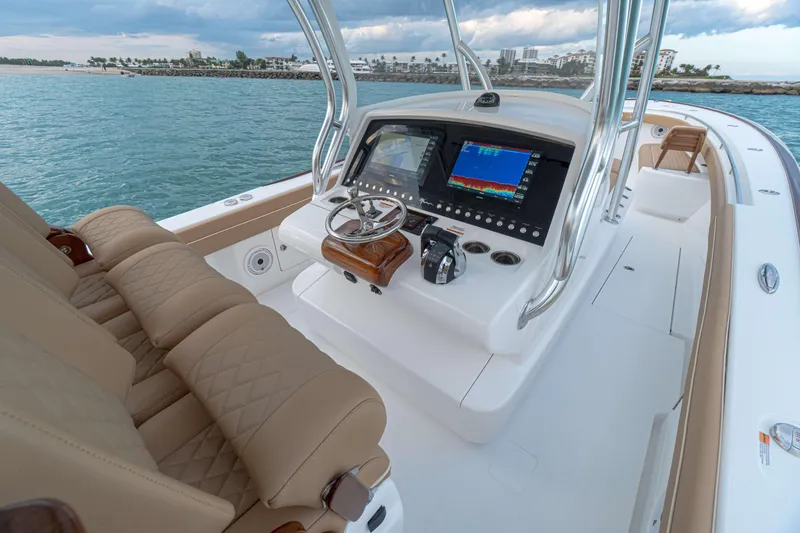 Slide: The Image of 2026 Valhalla Boatworks V-37 interior with modern dashboard and luxurious seating. - 4