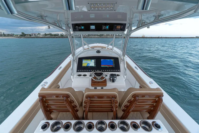 Slide: The Image of 2026 Valhalla Boatworks V-37 helm with advanced navigation system on open water. - 5