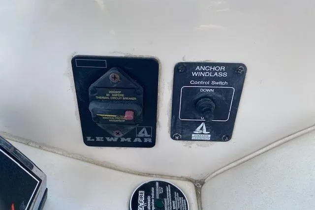 Slide: The Image of Control panel of a 2001 Monterey 302 Cruiser with anchor windlass switch and circuit breaker. - 10