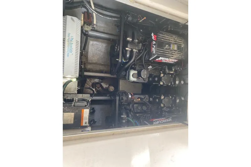 Slide: The Image of Engine compartment of a 2001 Monterey 302 Cruiser with Mercury engines. - 13