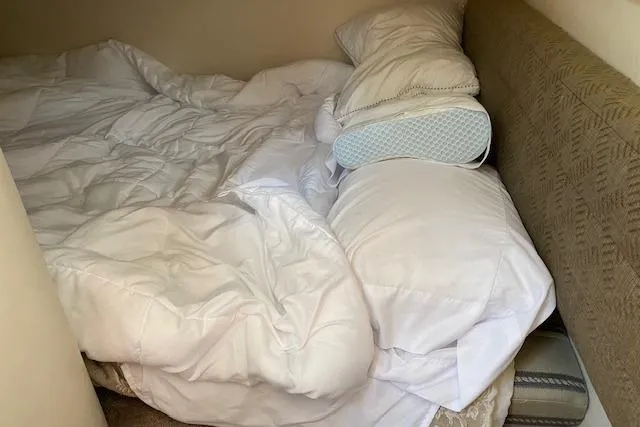 Slide: The Image of Cozy sleeping area inside a 2001 Monterey 302 Cruiser with white bedding and pillows. - 20