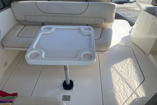 Slide: The Image of Interior of 2001 Monterey 302 Cruiser with seating and table setup. - 6