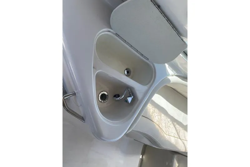 Slide: The Image of 2001 Monterey 302 Cruiser boat sink with faucet and storage compartment. - 7