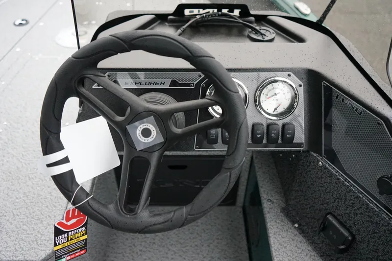 Slide: The Image of Steering wheel and dashboard of 2026 Lund 1800 Explorer Sport boat. - 10