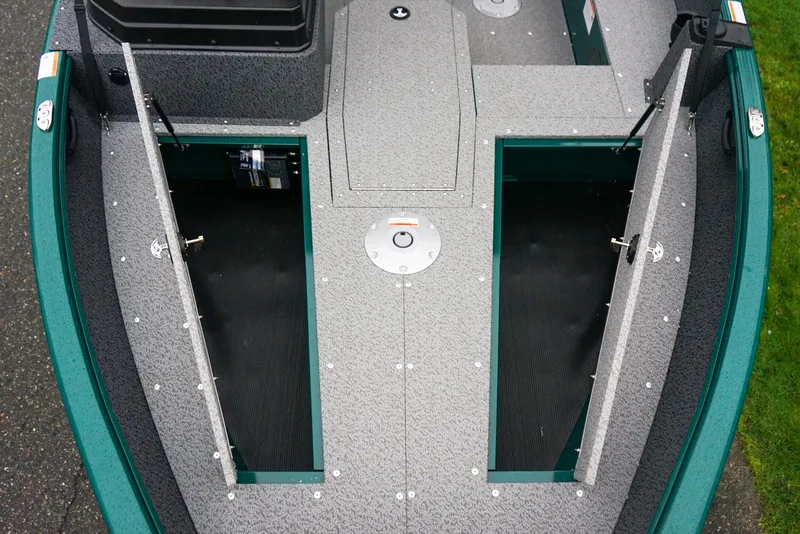 Slide: The Image of 2026 Lund 1800 Explorer Sport boat interior with open storage compartments. - 13