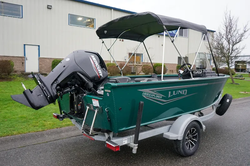 Slide: The Image of 2026 Lund 1800 Explorer Sport boat on trailer with Mercury outboard motor. - 3