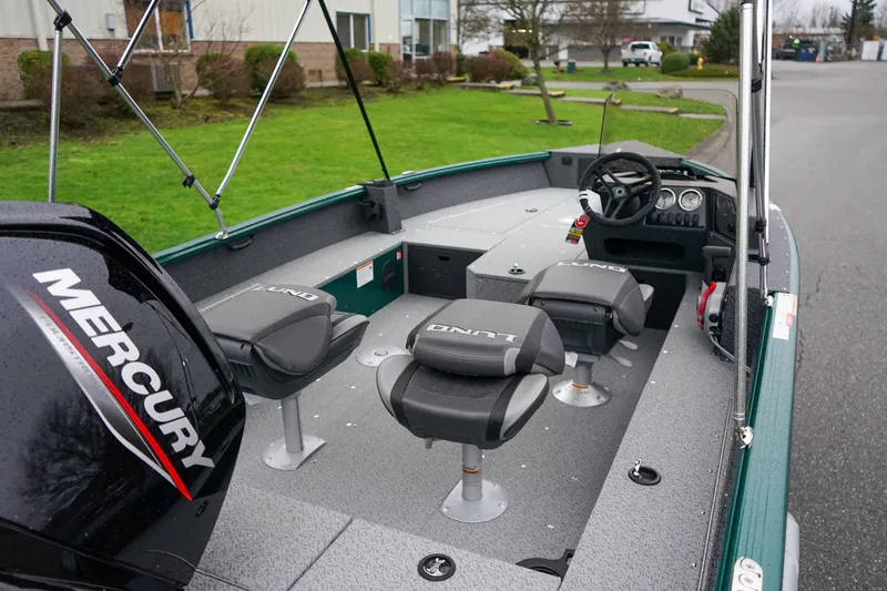 Slide: The Image of 2026 Lund 1800 Explorer Sport boat interior with Mercury engine and seating. - 5
