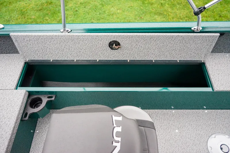 Slide: The Image of Interior view of 2026 Lund 1800 Explorer Sport boat with storage compartment. - 7