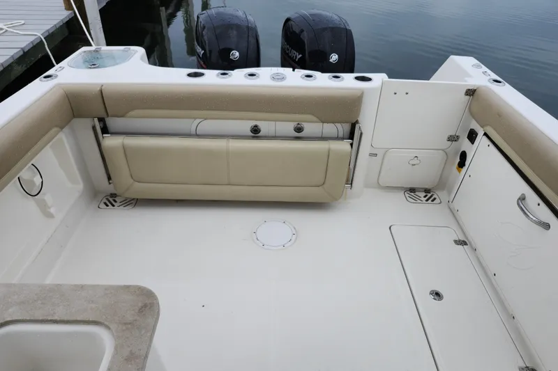 Slide: The Image of 2017 Sailfish 275 DC boat interior with seating and storage compartments. - 23