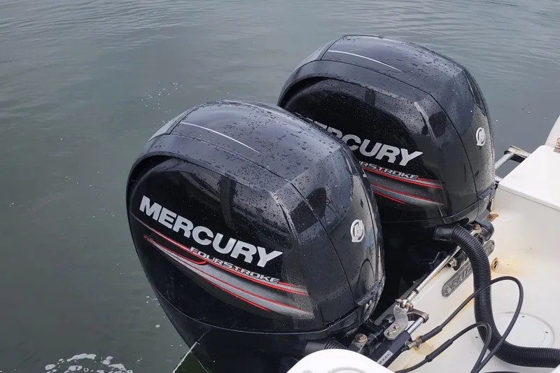 Slide: The Image of Twin Mercury FourStroke engines on a 2017 Sailfish 275 DC boat. - 28