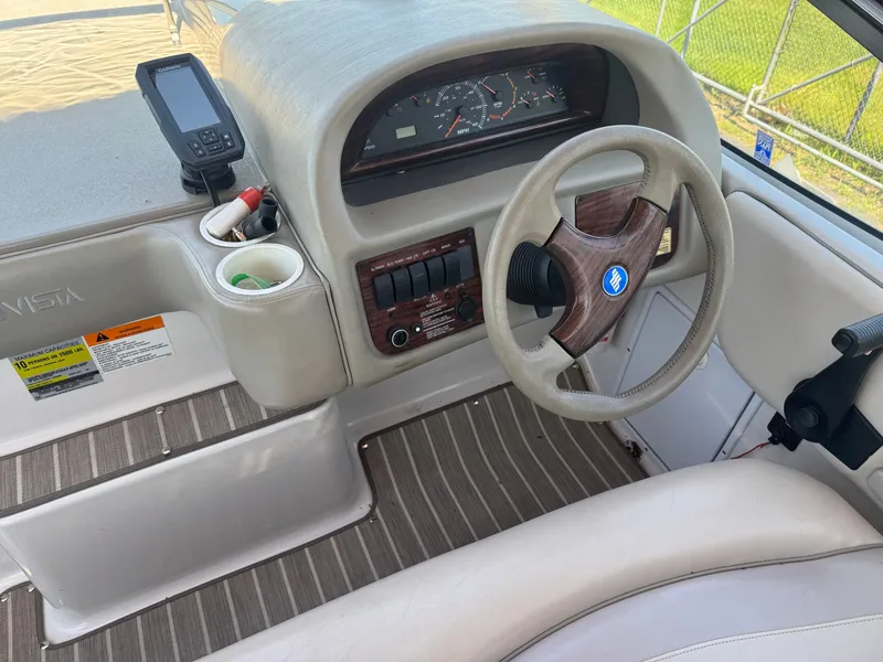 Slide: The Image of Interior view of 1999 Four Winns 258 Vista boat cockpit. - 3