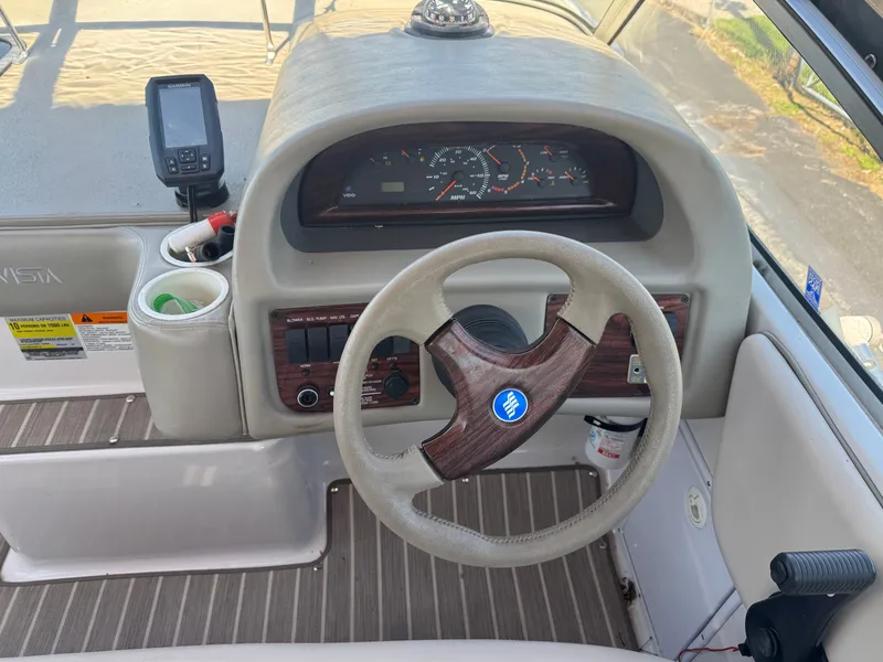 Slide: The Image of Dashboard of a 1999 Four Winns 258 Vista boat. - 4