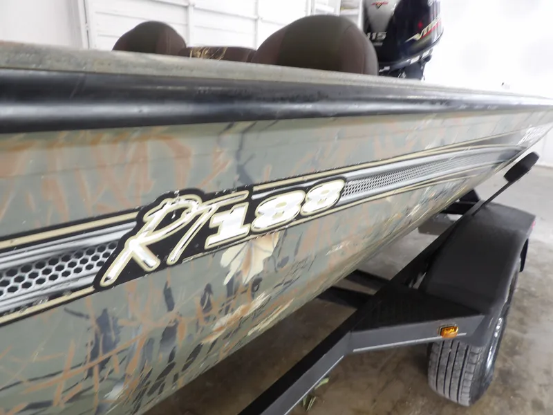 Slide: The Image of 2018 Ranger RT188 boat with camouflage design in a garage. - 15