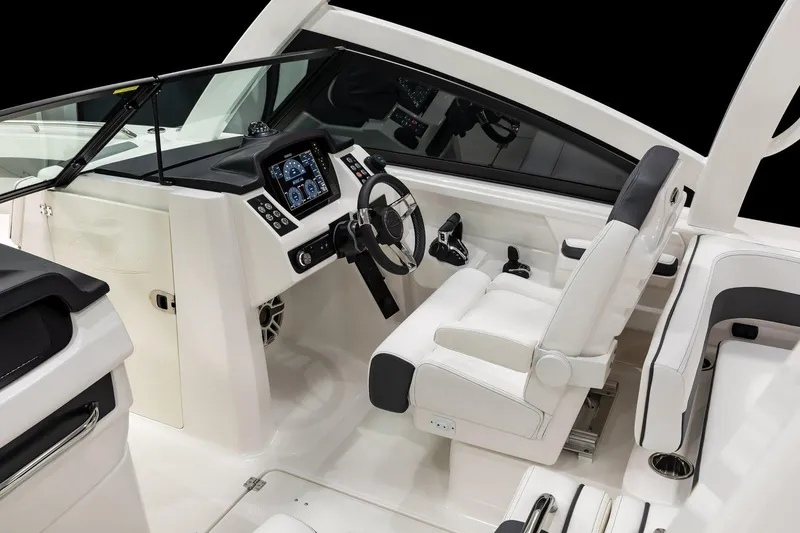 Slide: The Image of Manufacturer Provided Image: 2026 Robalo R277 Dual Console boat interior with modern dashboard and seating. - 5