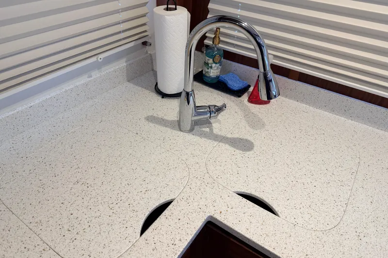 Slide: The Image of Modern kitchen sink with chrome faucet on American Tug 365 yacht, 2022 model. - 15