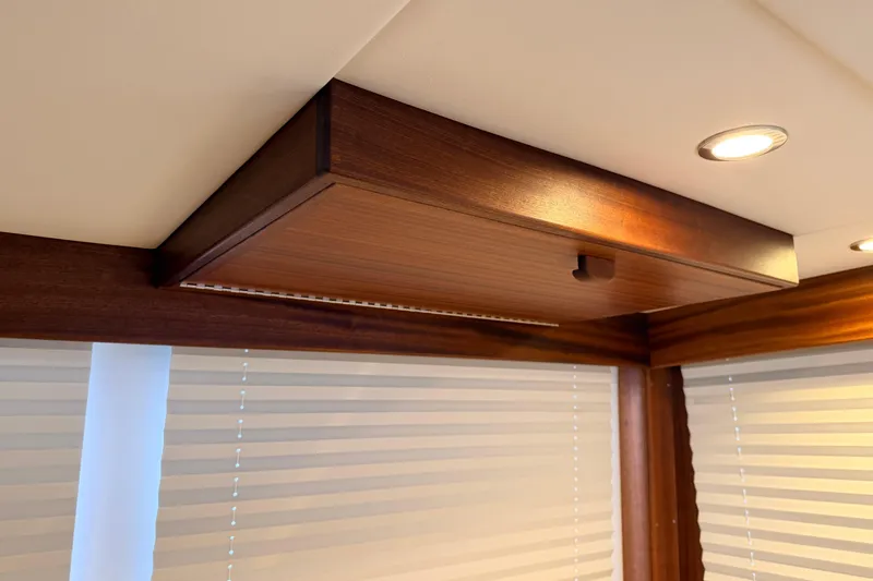 Slide: The Image of Interior of 2022 American Tug 365 with wooden cabinetry and recessed lighting. - 18