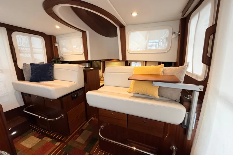 Slide: The Image of Interior of 2022 American Tug 365 with plush seating and elegant wood accents. - 24