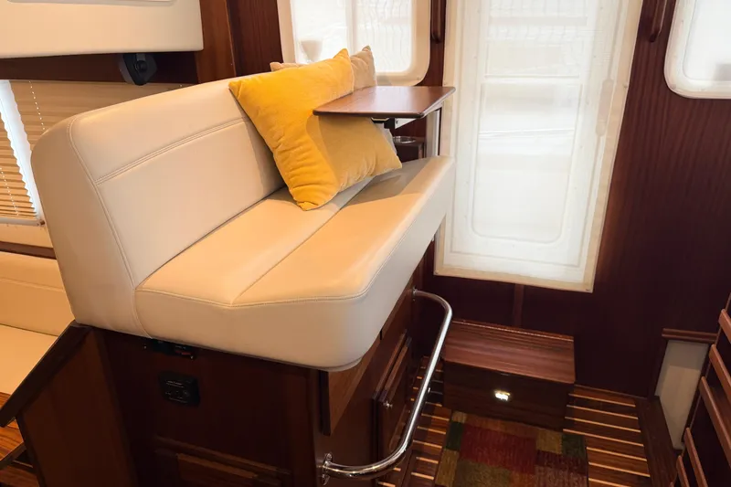 Slide: The Image of Luxurious interior of 2022 American Tug 365 with plush seating and wooden accents. - 25